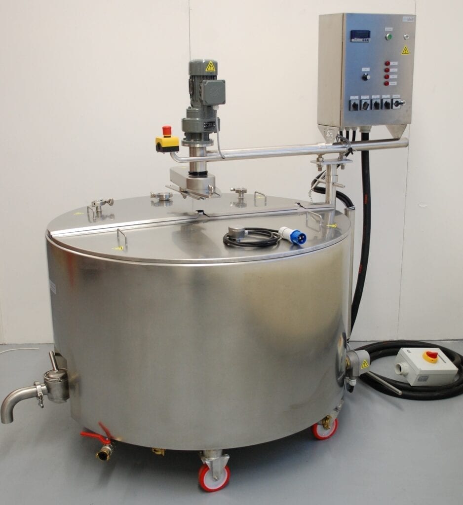 A stainless steel industrial mixing tank with attached control panel.