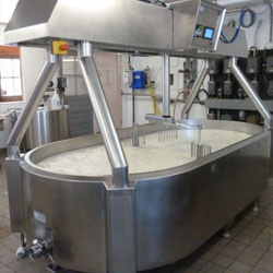 Oblong cheese vat machinery on a white background