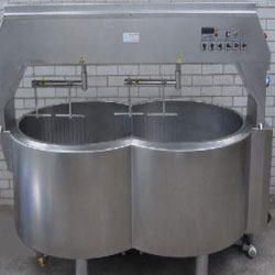 Double O cheese vat machinery on a white background
