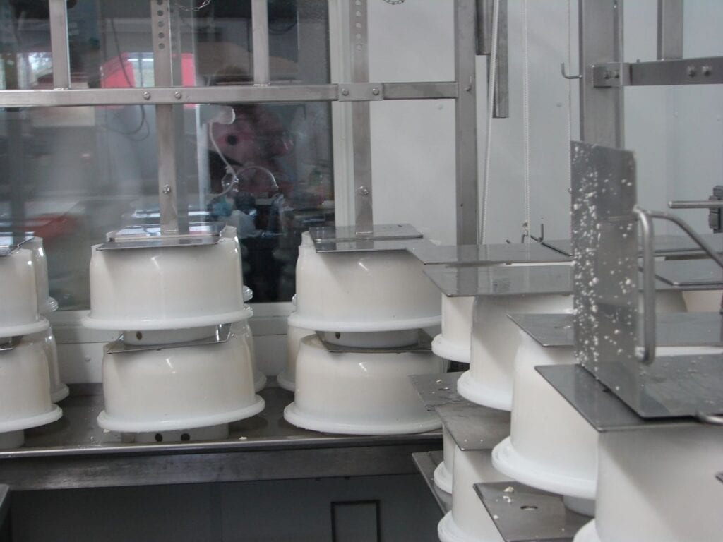 Industrial manufacturing machinery with cylindrical components.