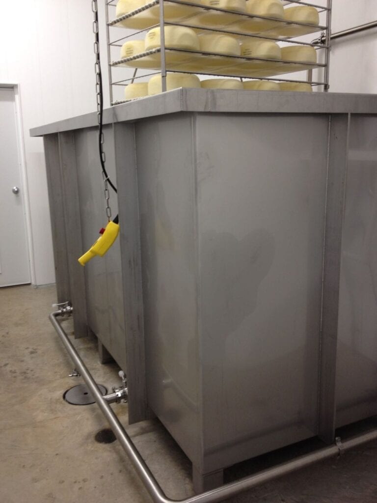 Above floor brining system with filtering and cooling system