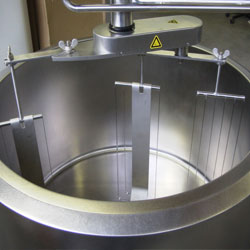 Round cheese vat machinery on a white background