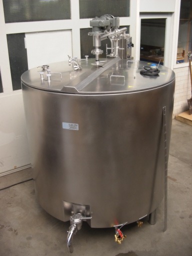 Large stainless steel industrial tank with a spigot at the bottom.
