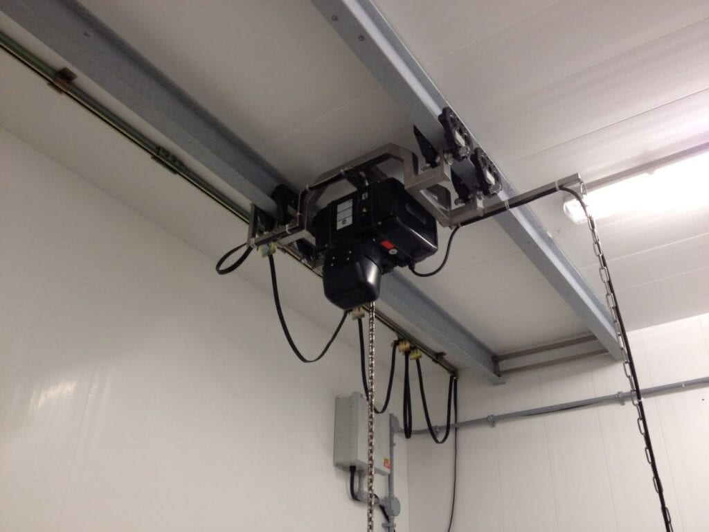 Hoist system machinery runs on 2 beams