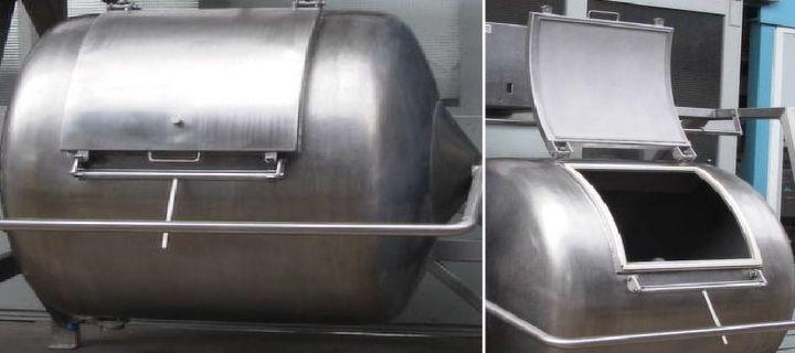 Large stainless steel industrial tank with rounded edges and attached piping.