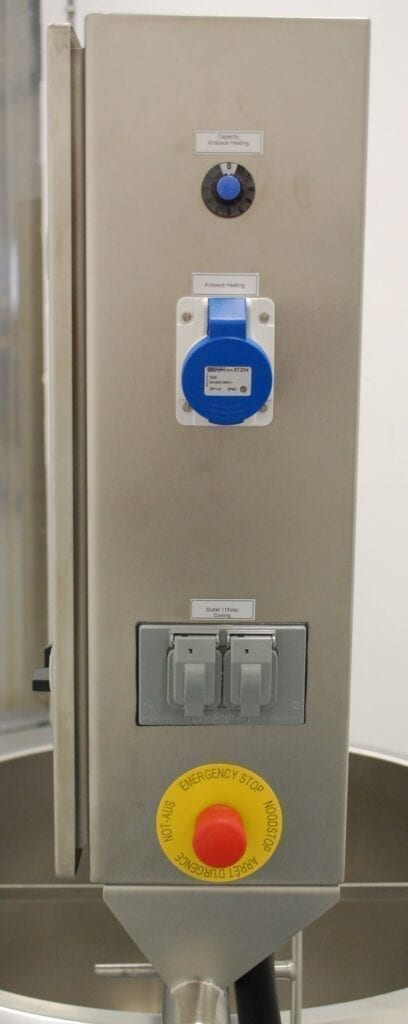 Electrical panel with labeled switches and a blue socket above.