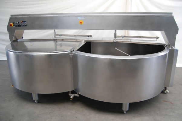 Large stainless steel industrial food processing equipment.