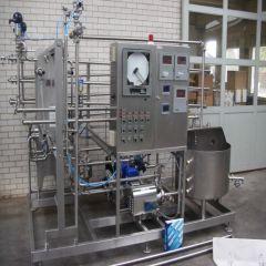 Industrial stainless steel equipment in a factory setting.